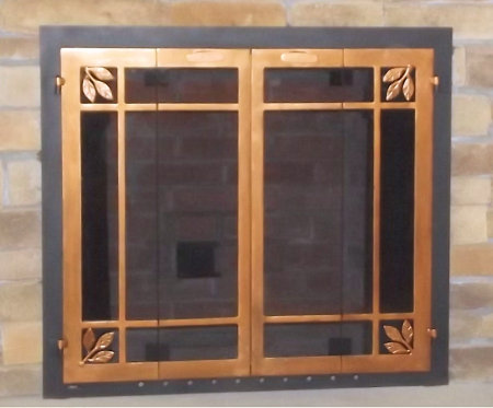 Natures window black frame, with  antique copper finish vice bi fold doors. Includes olive leaves in window pane design, smoked glass. Comes with slide mesh spark screens.